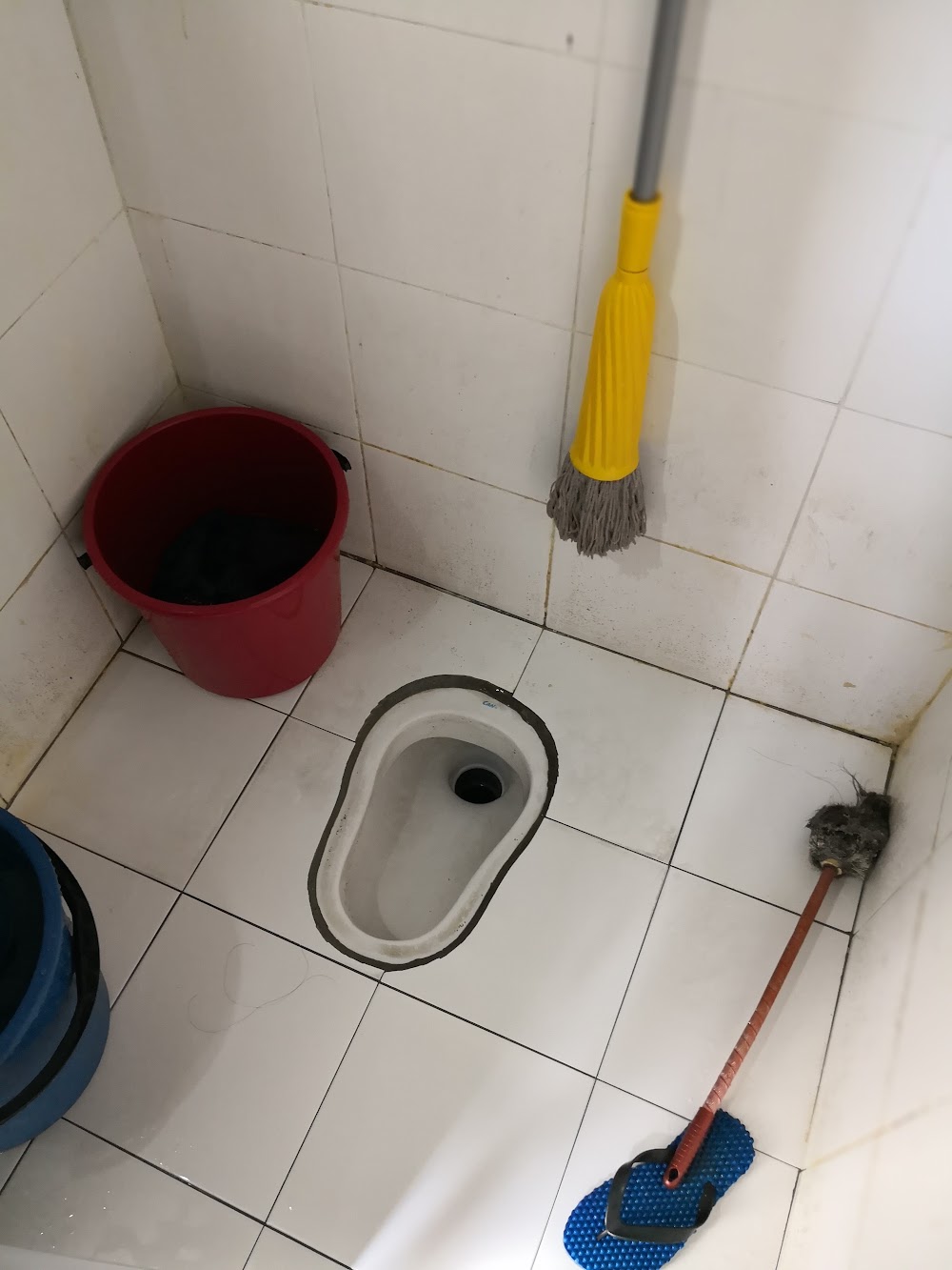 Toilet with bowl and cleaning supplies — House 114, bilik sewa pekerja di Taman Senai Baru, Senai