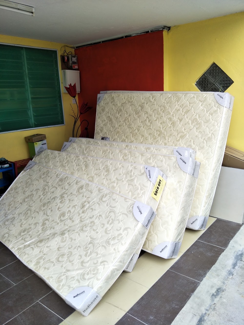 Clothes rack with hanging garments outside — House 175, bilik sewa pekerja di Taman Senai Baru, Senai